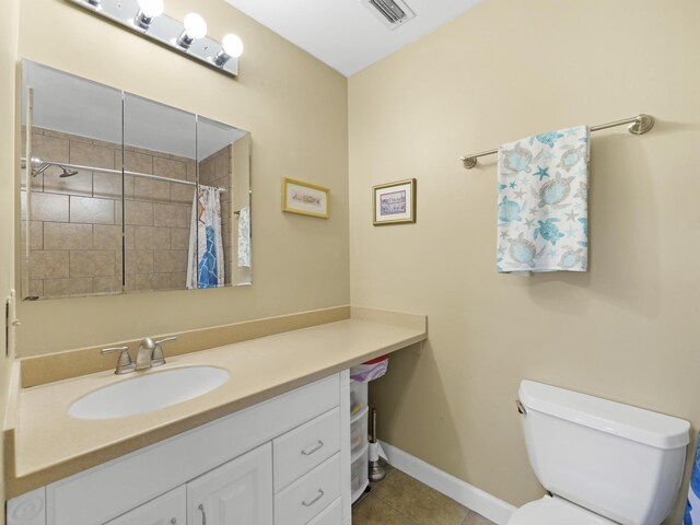 890 A1A Beach Blvd Unit 3, Saint Augustine, FL 32080 - full bath featuring vanity, tile patterned floors, toilet, baseboards, and tiled shower