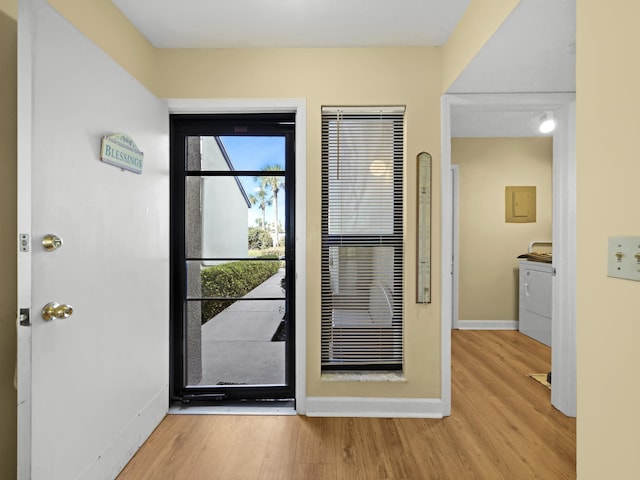 890 A1A Beach Blvd Unit 3, Saint Augustine, FL 32080 - entryway with wood finished floors, baseboards, washer / clothes dryer, and electric panel