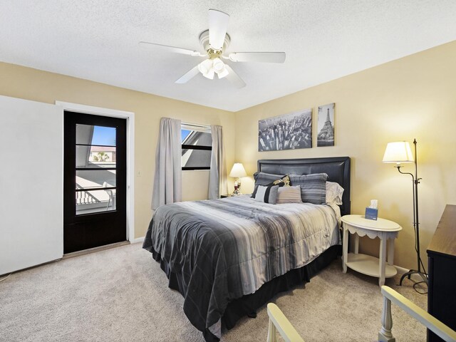 890 A1A Beach Blvd Unit 3, Saint Augustine, FL 32080 - bedroom featuring carpet flooring, a ceiling fan, baseboards, and a textured ceiling