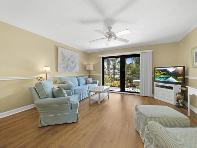 890 A1A Beach Blvd Unit 3, Saint Augustine, FL 32080 - living area with wood finished floors, ornamental molding, ceiling fan, and baseboards