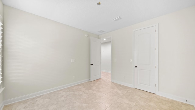 unfurnished bedroom featuring light tile patterned floors