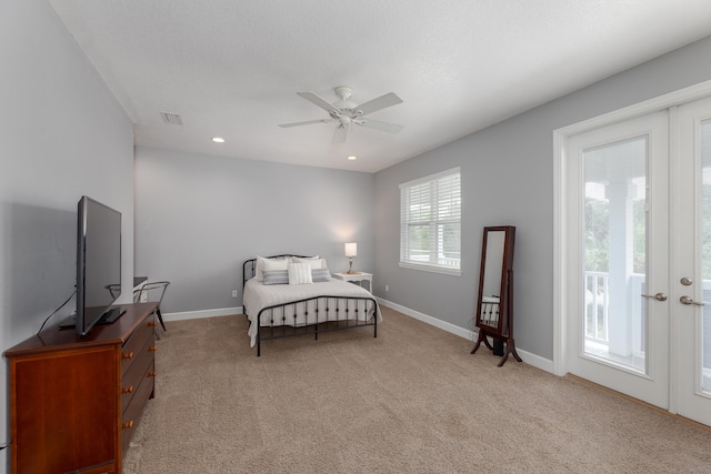 carpeted bedroom with french doors, access to outside, and ceiling fan