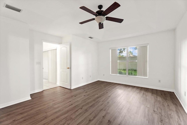 980 Windward Way, Saint Augustine, FL 32080 - unfurnished room with wood finished floors, a ceiling fan, baseboards, and a tray ceiling