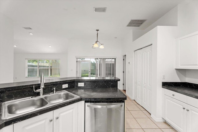 980 Windward Way, Saint Augustine, FL 32080 - kitchen with dishwasher, a sink, dark countertops, white cabinetry, and light tile patterned flooring