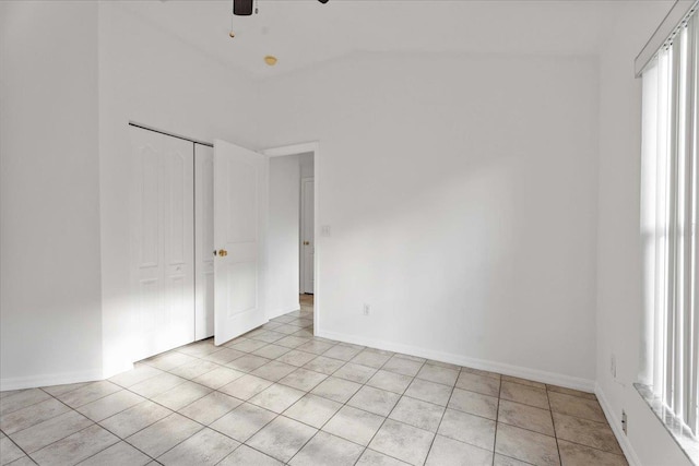 980 Windward Way, Saint Augustine, FL 32080 - unfurnished room with light tile patterned flooring, a ceiling fan, lofted ceiling, and baseboards