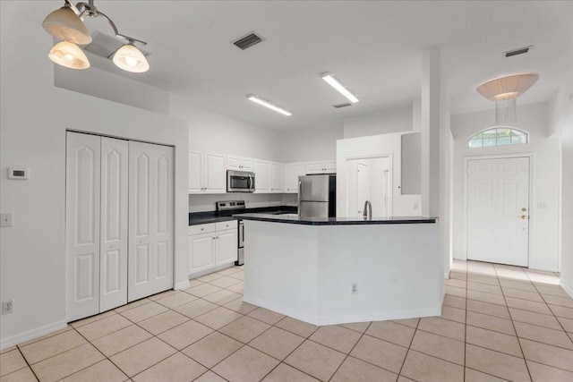 980 Windward Way, Saint Augustine, FL 32080 - kitchen with appliances with stainless steel finishes, dark countertops, and light tile patterned floors