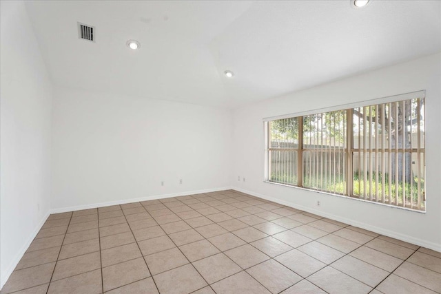 980 Windward Way, Saint Augustine, FL 32080 - spare room with vaulted ceiling, light tile patterned floors, recessed lighting, and baseboards