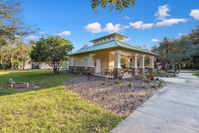 exterior space with a lawn and fence