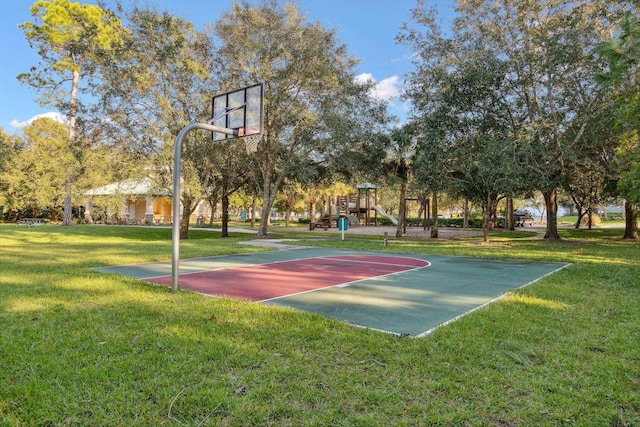 view of basketball court featuring community basketball court, a lawn, and playground community