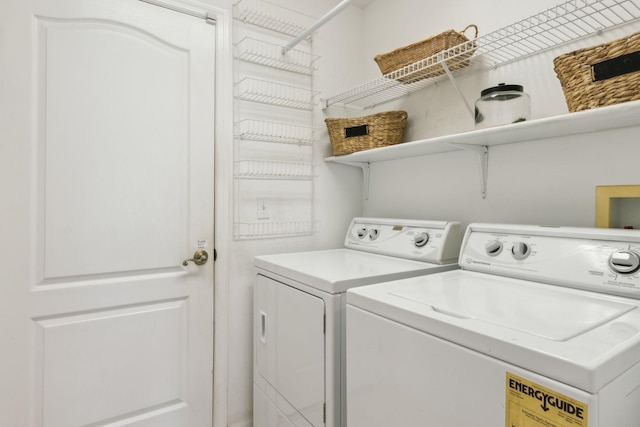 washroom featuring laundry area and independent washer and dryer