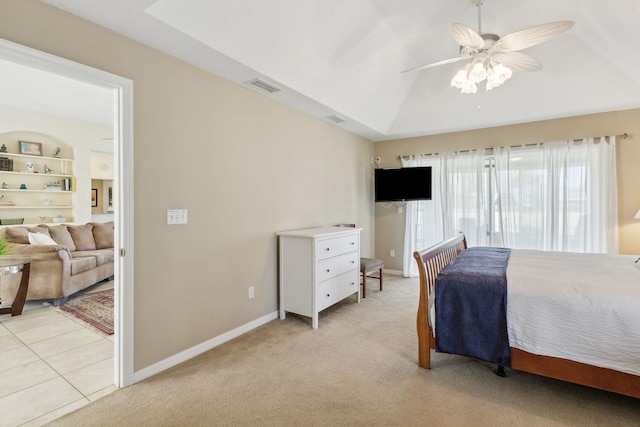 bedroom with lofted ceiling, baseboards, visible vents, and light colored carpet