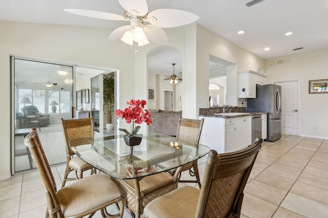 dining space featuring a ceiling fan, recessed lighting, a wealth of natural light, and light tile patterned floors