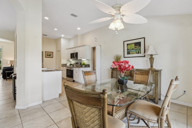 dining room featuring arched walkways, light tile patterned flooring, visible vents, and recessed lighting