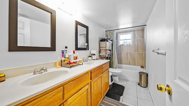 full bathroom featuring shower / bath combo with shower curtain, tile patterned floors, vanity, and toilet