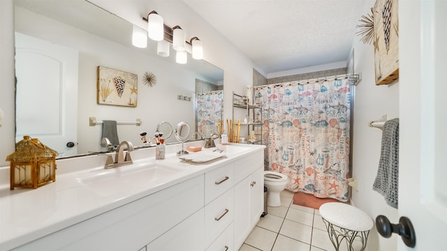 bathroom with toilet, tile patterned floors, a textured ceiling, vanity, and curtained shower