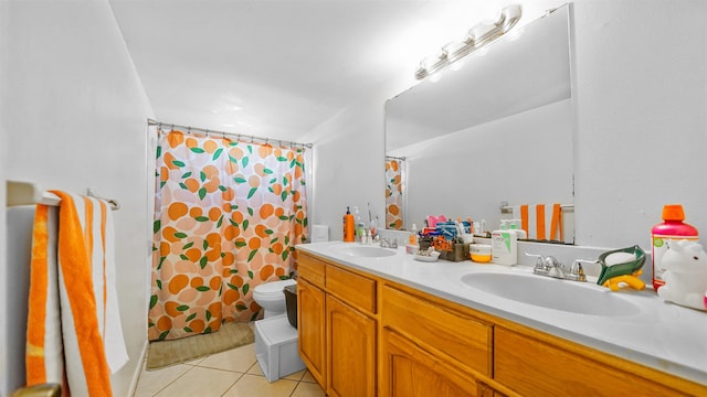 bathroom with toilet, vanity, a shower with shower curtain, and tile patterned flooring