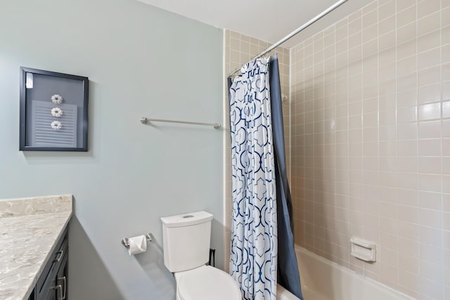 full bathroom featuring shower / bath combination with curtain, vanity, and toilet