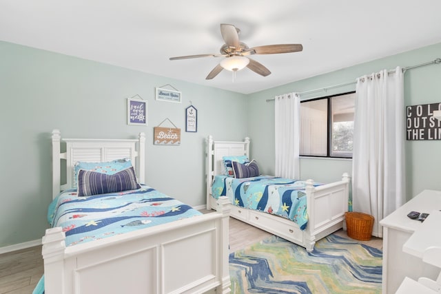 bedroom featuring ceiling fan and light hardwood / wood-style flooring