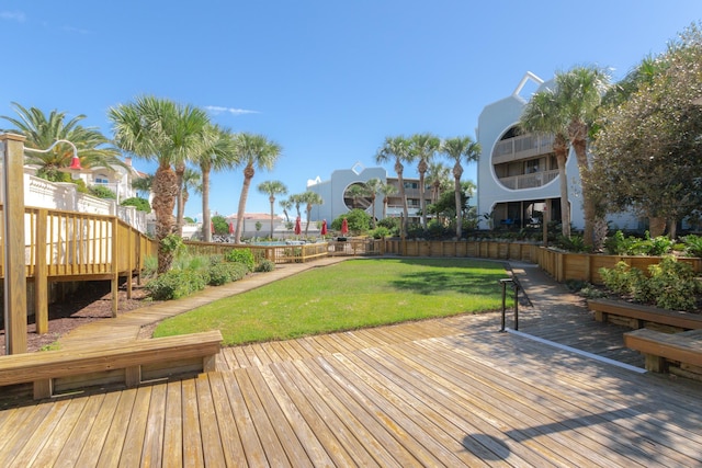 wooden terrace with a yard