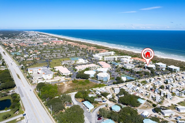 aerial view featuring a water view and a beach view