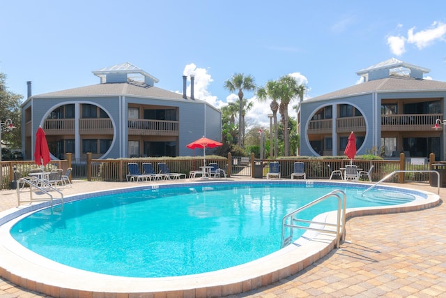 view of pool featuring a patio