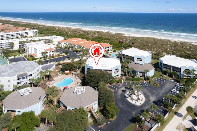 aerial view featuring a water view and a beach view