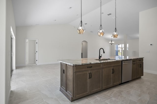 kitchen featuring dishwasher, a kitchen island with sink, sink, vaulted ceiling, and light stone countertops