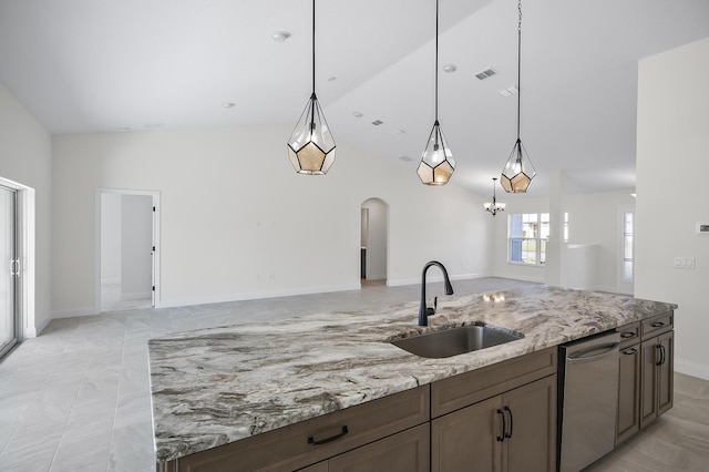 kitchen featuring dishwasher, light stone countertops, sink, and vaulted ceiling