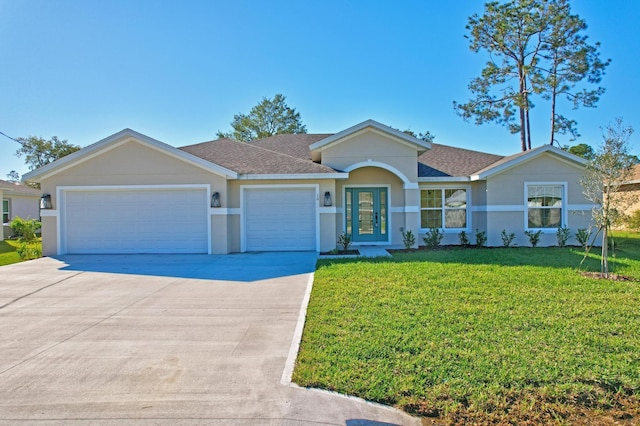 ranch-style house featuring french doors, a front lawn, and a garage