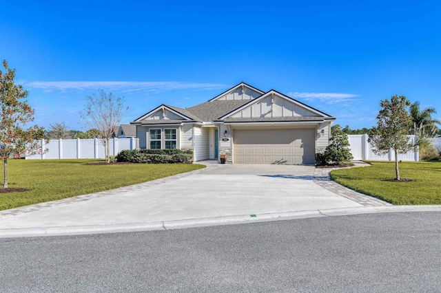 view of front of property featuring a garage and a front lawn