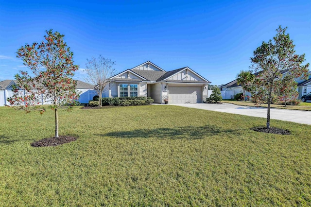 view of front facade with a garage and a front lawn