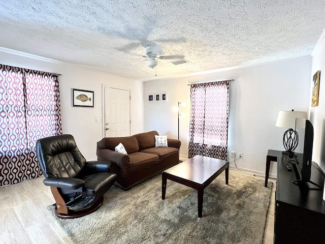 5961 S A1A, Saint Augustine, FL 32080 - living area with ceiling fan, wood finished floors, and a textured ceiling