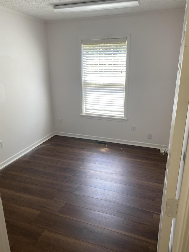5961 S A1A, Saint Augustine, FL 32080 - spare room featuring dark wood-type flooring and baseboards