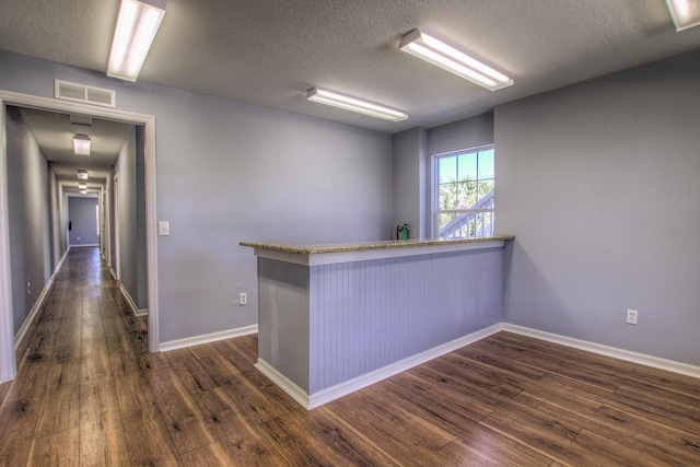 5961 S A1A, Saint Augustine, FL 32080 - corridor featuring dark wood-style flooring and a textured ceiling