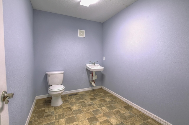 5961 S A1A, Saint Augustine, FL 32080 - half bathroom featuring toilet and baseboards