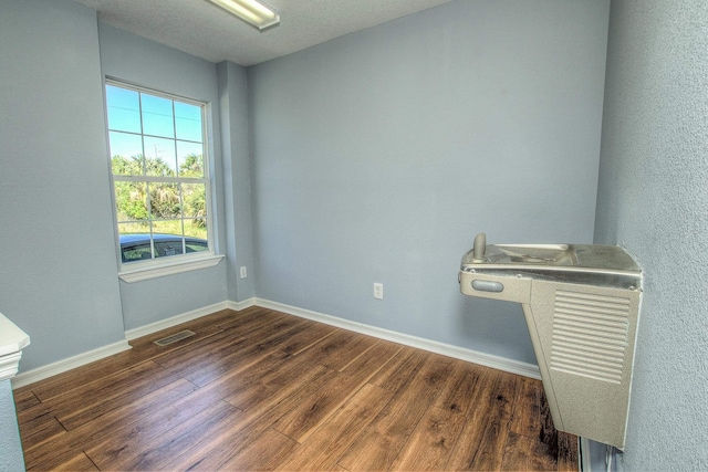 5961 S A1A, Saint Augustine, FL 32080 - spare room with dark wood-style floors and baseboards