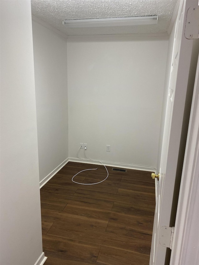 5961 S A1A, Saint Augustine, FL 32080 - unfurnished room featuring dark wood finished floors and a textured ceiling