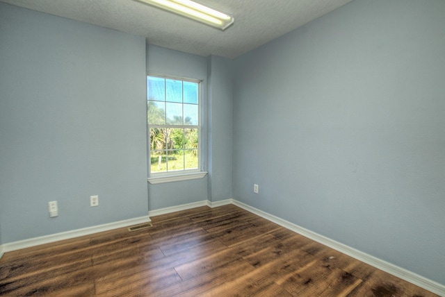 5961 S A1A, Saint Augustine, FL 32080 - unfurnished room with dark wood-type flooring and baseboards