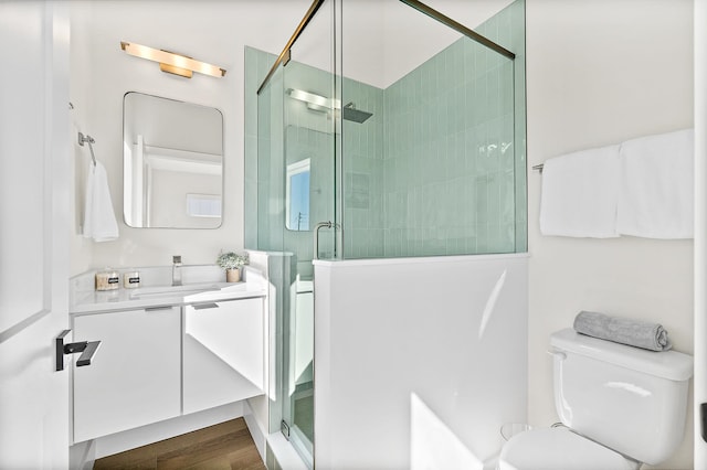 194 Riberia St, Saint Augustine, FL 32084 - full bathroom with vanity, a stall shower, and wood finished floors