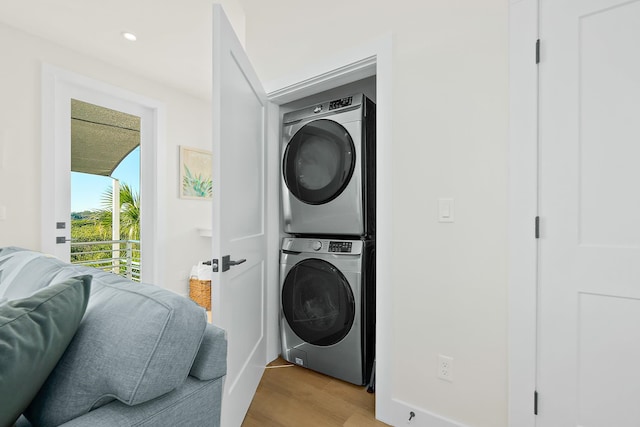 194 Riberia St, Saint Augustine, FL 32084 - laundry room featuring stacked washer / drying machine, light wood-type flooring, and recessed lighting