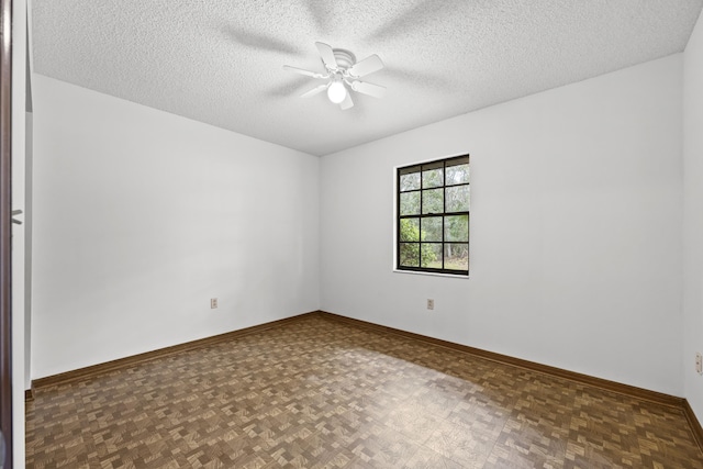 spare room featuring ceiling fan and a textured ceiling