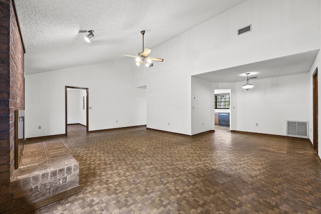 unfurnished living room with dark parquet flooring, a textured ceiling, ceiling fan, high vaulted ceiling, and a fireplace