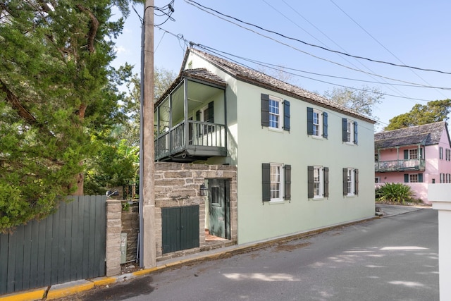 view of home's exterior featuring a balcony