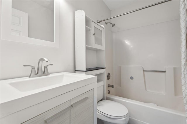 full bathroom featuring vanity, shower / bath combo with shower curtain, and toilet