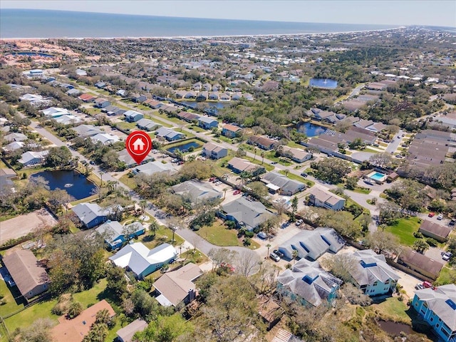 birds eye view of property with a residential view and a water view