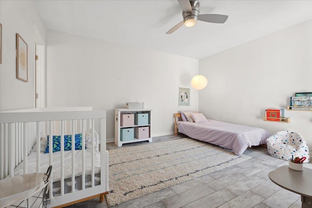 bedroom featuring ceiling fan and wood finished floors