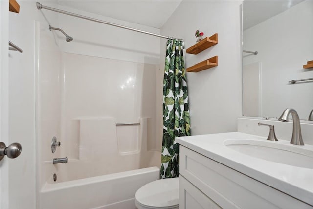 bathroom with toilet, shower / bath combo, and vanity