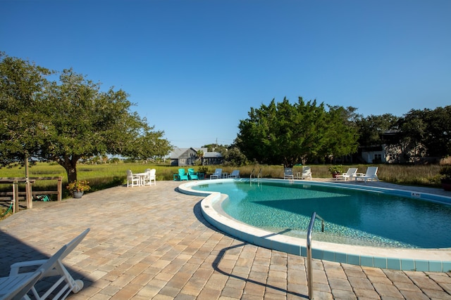 view of pool featuring a patio area