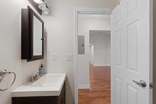 bathroom with vanity and hardwood / wood-style flooring