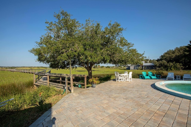 view of patio with a rural view